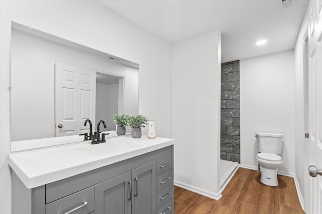 1320 Coker Dr, Dalton, GA 30721 - full bathroom featuring vanity, a stall shower, wood finished floors, and recessed lighting