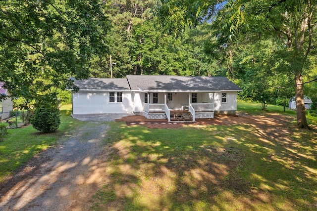 1320 Coker Dr, Dalton, GA 30721 - view of front of house with covered porch, a front yard, dirt driveway, and roof with shingles