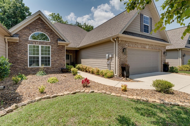 2742 Amsterdam Ln Unit 14, Chattanooga, TN 37421 - traditional home featuring brick siding, driveway, roof with shingles, a garage, and a front lawn