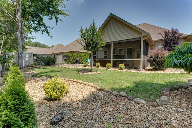 2742 Amsterdam Ln Unit 14, Chattanooga, TN 37421 - back of property with a sunroom, a fenced backyard, a shingled roof, and ceiling fan