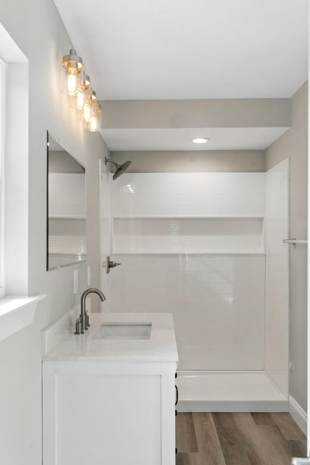 2207 Spencer Ave, Chattanooga, TN 37421 - bathroom with wood finished floors, vanity, a tile shower, and recessed lighting