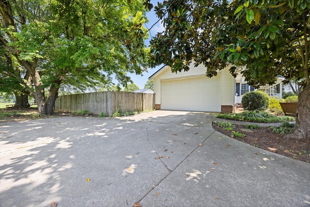 119 Broadacre Rd NE, Dalton, GA 30721 - view of side of home with driveway and a garage