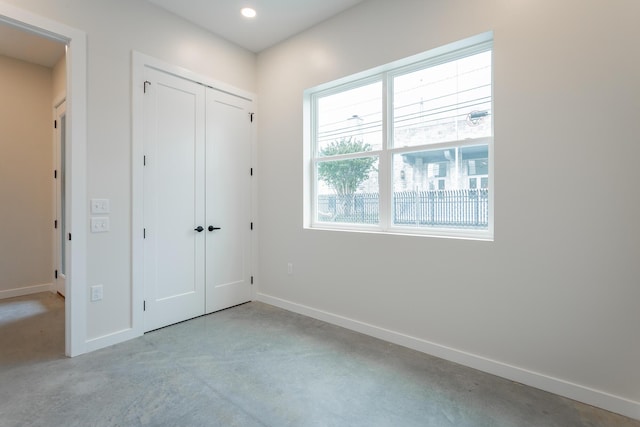 1857 Zeta Way, Chattanooga, TN 37404 - unfurnished bedroom featuring concrete flooring, a closet, and recessed lighting