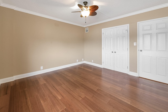 1131 Stringers Ridge Rd Unit 4C, Chattanooga, TN 37405 - unfurnished bedroom featuring dark wood-style flooring, crown molding, a closet, and ceiling fan