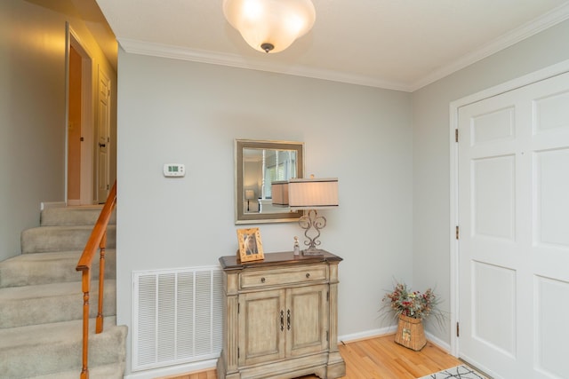 1510 Cannon Dr, Fort Oglethorpe, GA 30742 - entryway featuring light wood-type flooring, ornamental molding, and stairs