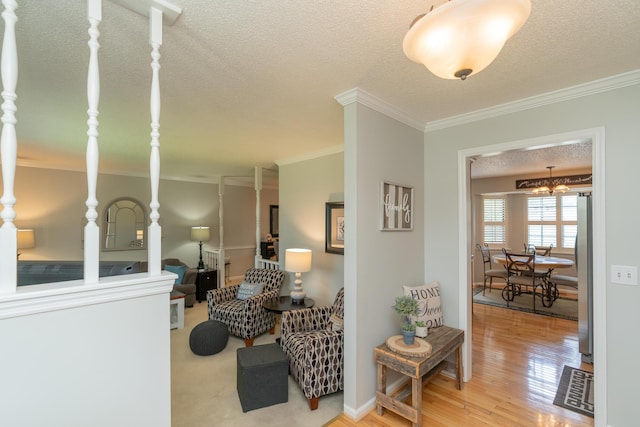 1510 Cannon Dr, Fort Oglethorpe, GA 30742 - living area featuring ornamental molding, a textured ceiling, and wood finished floors