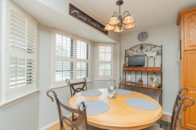1510 Cannon Dr, Fort Oglethorpe, GA 30742 - dining room featuring a chandelier and wood finished floors
