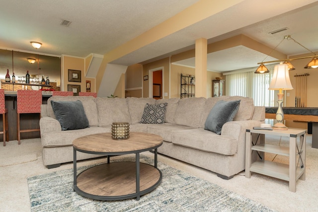 1510 Cannon Dr, Fort Oglethorpe, GA 30742 - carpeted living room featuring a textured ceiling and a bar