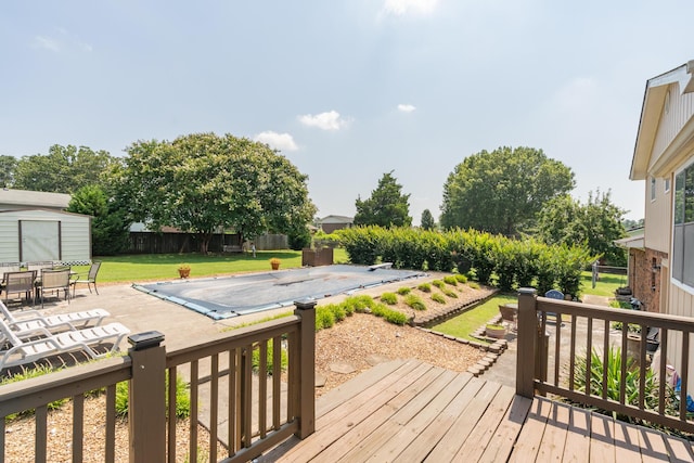 1510 Cannon Dr, Fort Oglethorpe, GA 30742 - wooden terrace with a patio, a storage shed, and outdoor dining space