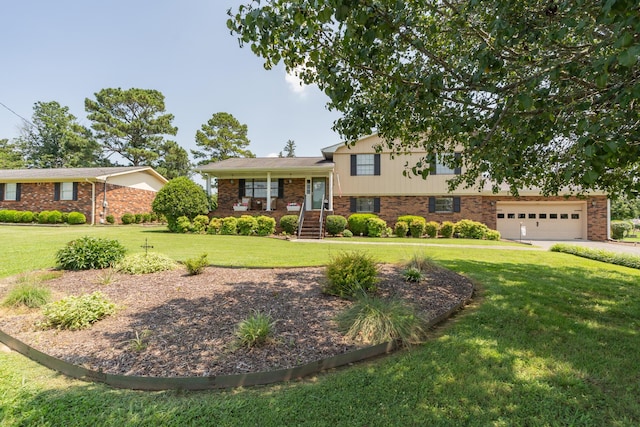 1510 Cannon Dr, Fort Oglethorpe, GA 30742 - tri-level home with a front yard, brick siding, an attached garage, and driveway