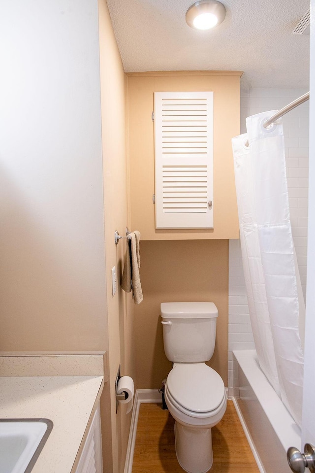 505 Heidi Cir, Chattanooga, TN 37415 - full bathroom with vanity, a textured ceiling, shower / bath combo with shower curtain, and wood finished floors