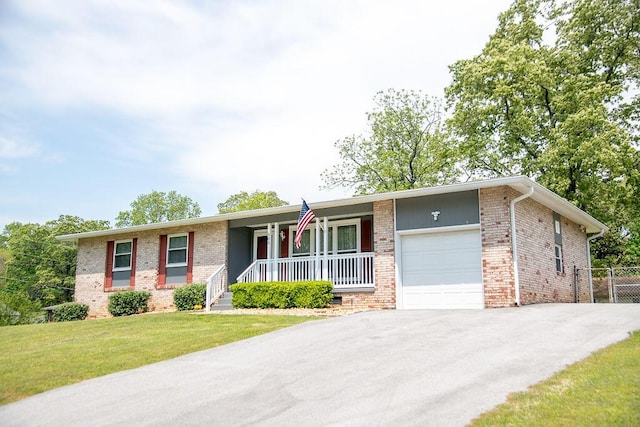 505 Heidi Cir, Chattanooga, TN 37415 - ranch-style house featuring an attached garage, a porch, brick siding, and driveway