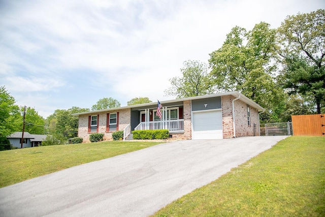 505 Heidi Cir, Chattanooga, TN 37415 - ranch-style house with driveway, a garage, brick siding, and covered porch