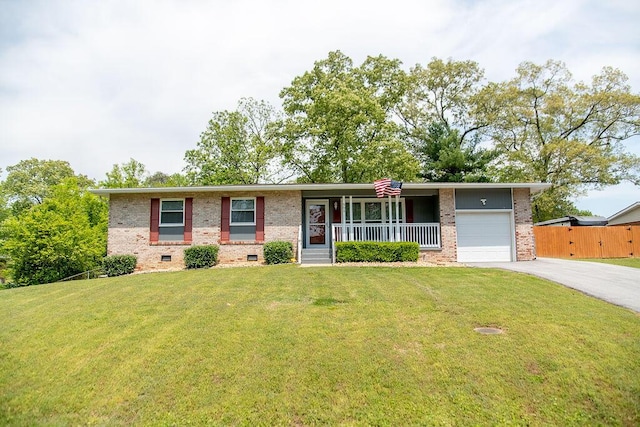 505 Heidi Cir, Chattanooga, TN 37415 - view of front of house with brick siding, covered porch, a garage, driveway, and a front yard
