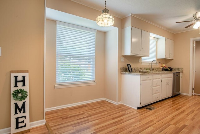 505 Heidi Cir, Chattanooga, TN 37415 - kitchen with stainless steel dishwasher, light wood-style flooring, white cabinetry, and crown molding