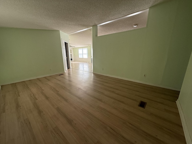 2487 Corinth Rd, Lafayette, GA 30728 - empty room featuring wood finished floors and a textured ceiling