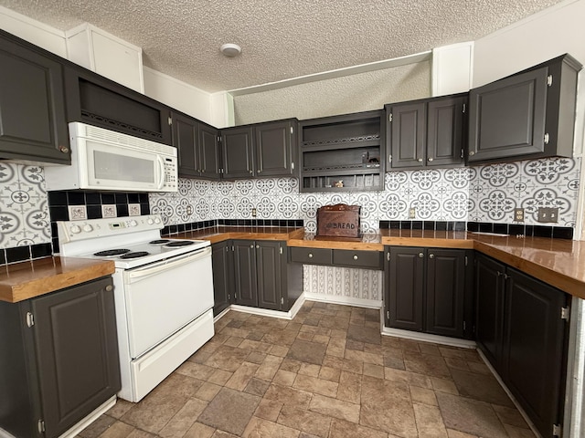 2487 Corinth Rd, Lafayette, GA 30728 - kitchen featuring white appliances, a textured ceiling, decorative backsplash, dark countertops, and open shelves