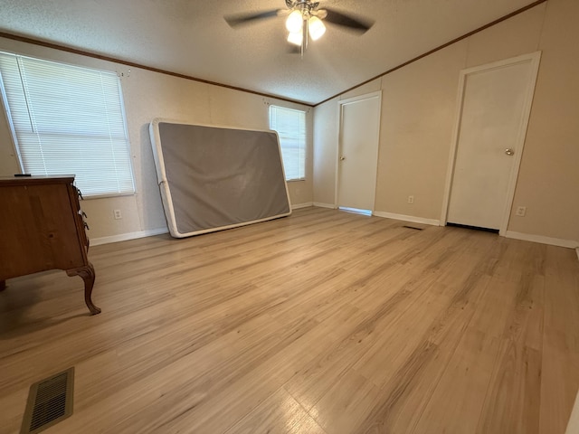2487 Corinth Rd, Lafayette, GA 30728 - unfurnished bedroom with a textured ceiling, light wood-type flooring, lofted ceiling, crown molding, and a ceiling fan