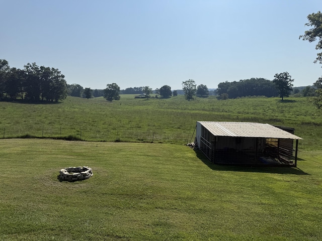2487 Corinth Rd, Lafayette, GA 30728 - view of green lawn with a fire pit, a rural view, an outbuilding, and an outdoor structure