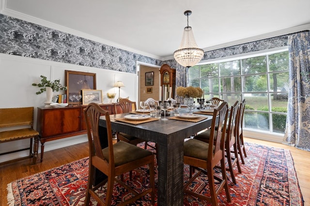 9420 Mountain Shadows Dr, Chattanooga, TN 37421 - dining area featuring a chandelier, healthy amount of natural light, wood finished floors, ornamental molding, and wallpapered walls