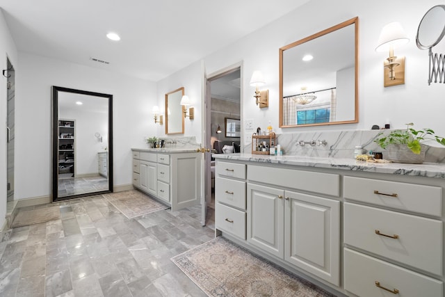 9420 Mountain Shadows Dr, Chattanooga, TN 37421 - bathroom featuring two vanities, recessed lighting, and tasteful backsplash