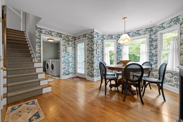 9420 Mountain Shadows Dr, Chattanooga, TN 37421 - dining area with wallpapered walls, washer and dryer, stairs, light wood-style floors, and crown molding