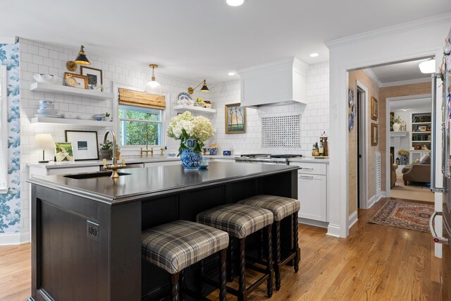9420 Mountain Shadows Dr, Chattanooga, TN 37421 - kitchen featuring open shelves, white cabinets, a kitchen island, decorative backsplash, and crown molding
