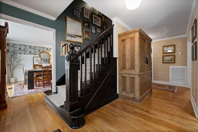9420 Mountain Shadows Dr, Chattanooga, TN 37421 - stairs with wallpapered walls, wood finished floors, and ornamental molding