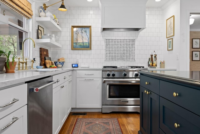9420 Mountain Shadows Dr, Chattanooga, TN 37421 - kitchen with appliances with stainless steel finishes, white cabinetry, tasteful backsplash, dark wood-type flooring, and custom range hood
