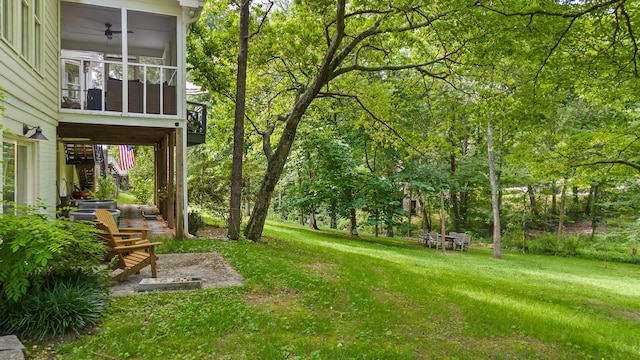 9420 Mountain Shadows Dr, Chattanooga, TN 37421 - view of grassy yard featuring a sunroom, a ceiling fan, and stairs