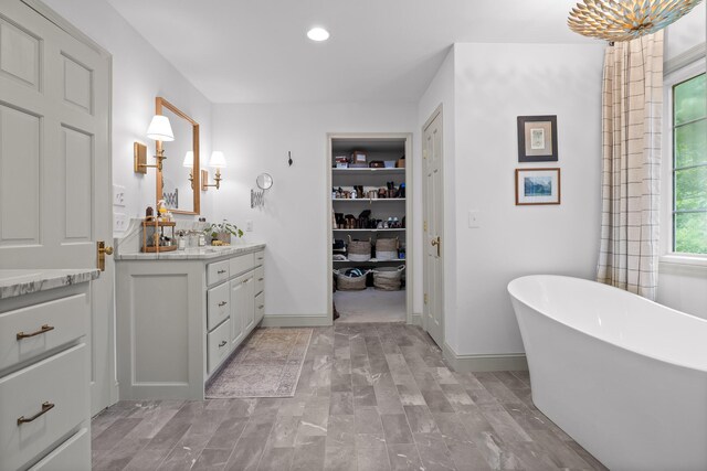 9420 Mountain Shadows Dr, Chattanooga, TN 37421 - bathroom with vanity, a freestanding tub, and recessed lighting
