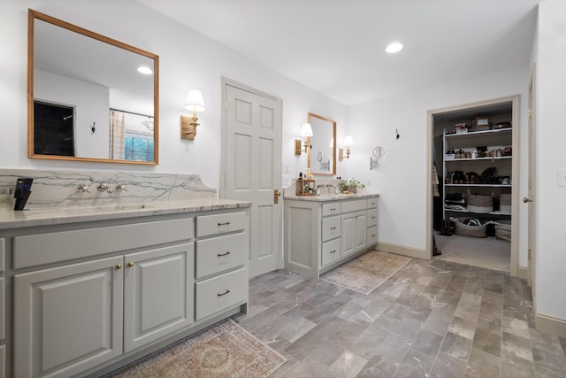 9420 Mountain Shadows Dr, Chattanooga, TN 37421 - bathroom featuring two vanities, recessed lighting, and a walk in closet