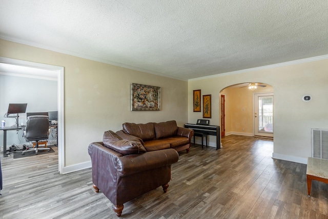 1602 Prater Rd, Chattanooga, TN 37412 - living area with arched walkways, crown molding, a textured ceiling, a desk, and wood finished floors