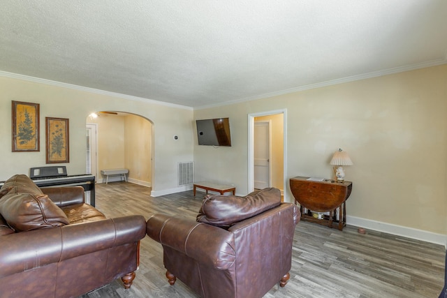 1602 Prater Rd, Chattanooga, TN 37412 - living room with arched walkways, wood finished floors, ornamental molding, and a textured ceiling
