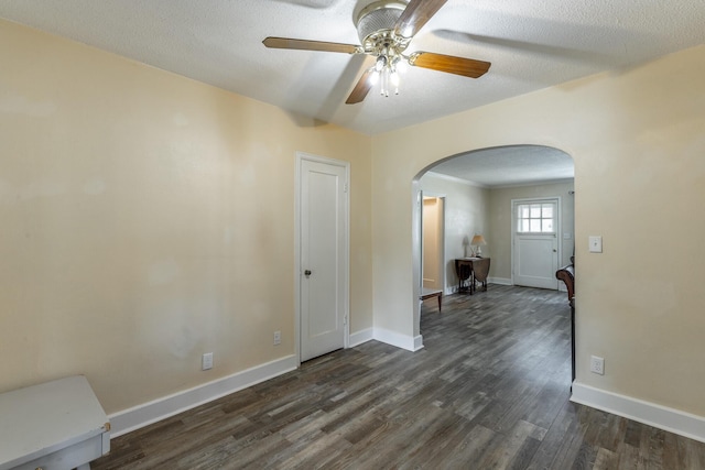 1602 Prater Rd, Chattanooga, TN 37412 - empty room featuring arched walkways, a ceiling fan, and dark wood-type flooring
