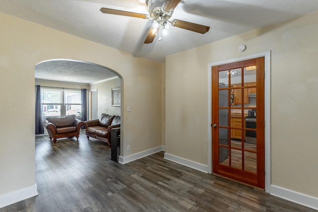 1602 Prater Rd, Chattanooga, TN 37412 - unfurnished room with arched walkways, dark wood finished floors, ceiling fan, a textured ceiling, and a smoke detector