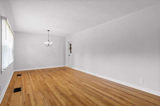 3671 Thrushwood Dr, Chattanooga, TN 37415 - unfurnished room with a chandelier and light wood-style flooring