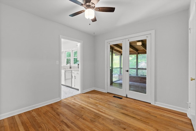 3671 Thrushwood Dr, Chattanooga, TN 37415 - spare room featuring french doors, healthy amount of natural light, light wood finished floors, and ceiling fan