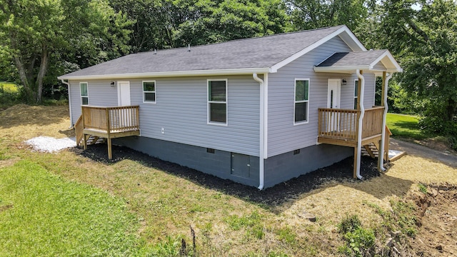 1150 Lang St NE, Cleveland, TN 37311 - view of property exterior featuring crawl space, roof with shingles, and a lawn