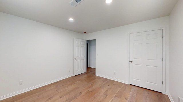 1150 Lang St NE, Cleveland, TN 37311 - unfurnished bedroom featuring light wood-style flooring and recessed lighting