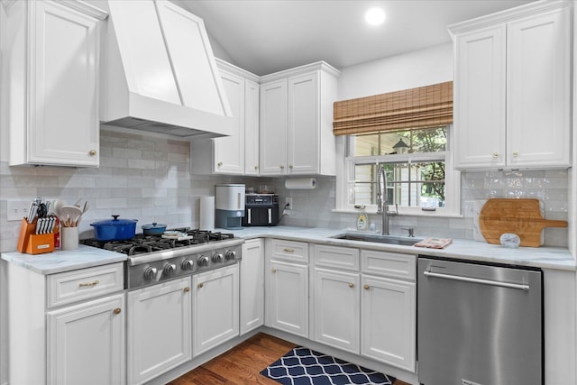 110 Linden St, Lookout Mountain, TN 37350 - kitchen with appliances with stainless steel finishes, custom range hood, white cabinets, tasteful backsplash, and dark wood-style flooring