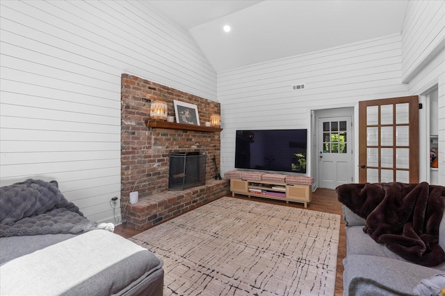 110 Linden St, Lookout Mountain, TN 37350 - living room featuring wood finished floors, wood walls, high vaulted ceiling, a brick fireplace, and recessed lighting