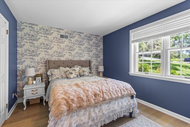 110 Linden St, Lookout Mountain, TN 37350 - bedroom featuring wood finished floors and wallpapered walls