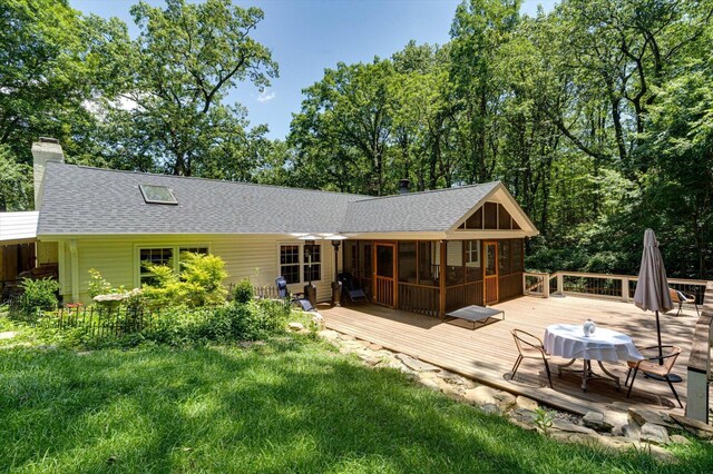 110 Linden St, Lookout Mountain, TN 37350 - back of property featuring roof with shingles, a wooden deck, a chimney, and a sunroom