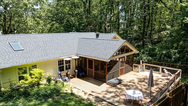 110 Linden St, Lookout Mountain, TN 37350 - back of house featuring roof with shingles, a sunroom, and a wooden deck