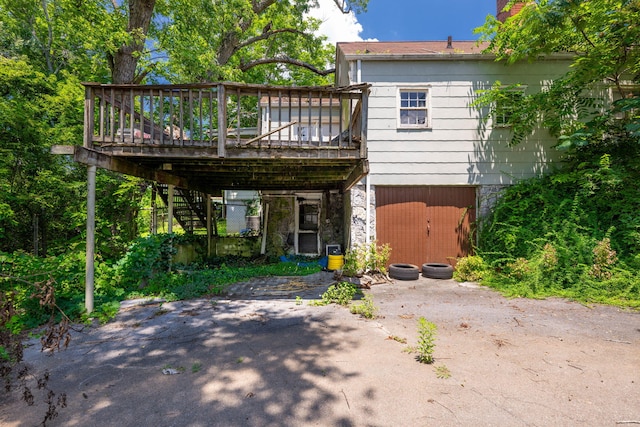 2015 James Ave, Chattanooga, TN 37415 - rear view of property featuring stairs, stone siding, and a deck