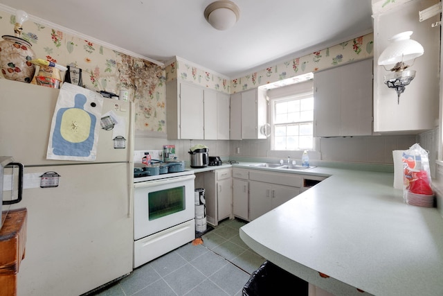 2015 James Ave, Chattanooga, TN 37415 - kitchen with white appliances, wallpapered walls, light countertops, crown molding, and light tile patterned flooring