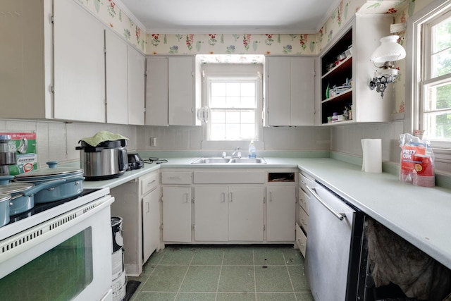 2015 James Ave, Chattanooga, TN 37415 - kitchen with light countertops, dishwasher, white cabinets, open shelves, and white range with electric cooktop
