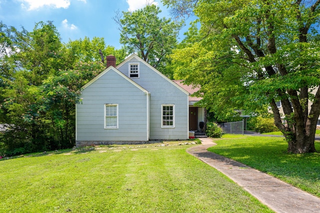 2015 James Ave, Chattanooga, TN 37415 - rear view of house featuring a chimney and a lawn