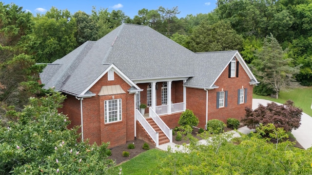 4101 Finch Ln, Chattanooga, TN 37419 - view of front of property featuring brick siding, roof with shingles, covered porch, stairway, and a front yard